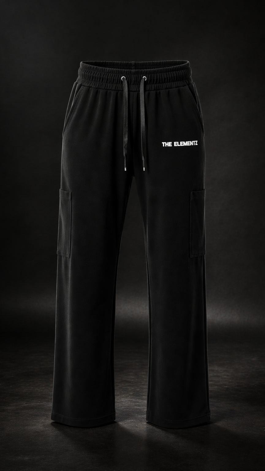 Black pants with 'THE ELEMENTS' logo on a dark background